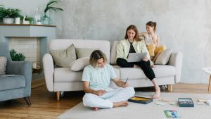 A family enjoying quality time together in a cozy living room setting, bonding and working.